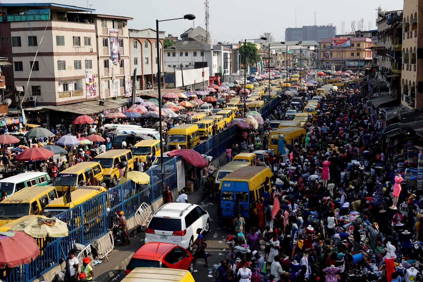 Millions of Nigerians are working, but Moody’s says many earn nine times less outside formal jobs