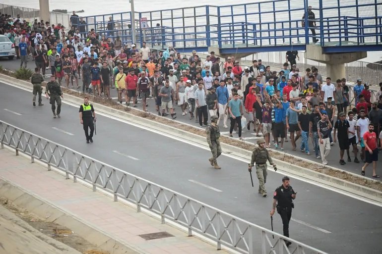 Up to 9,000 migrants remain in Spain’s African enclave after 72,000 crossed from Morocco