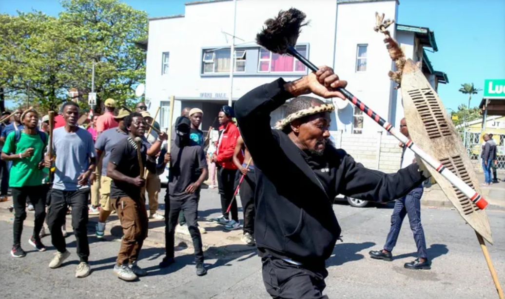 South Africa backtracks on asylum directive after violent anti-migrant riots leave 24 vehicles torched and foreign shops looted across major cities